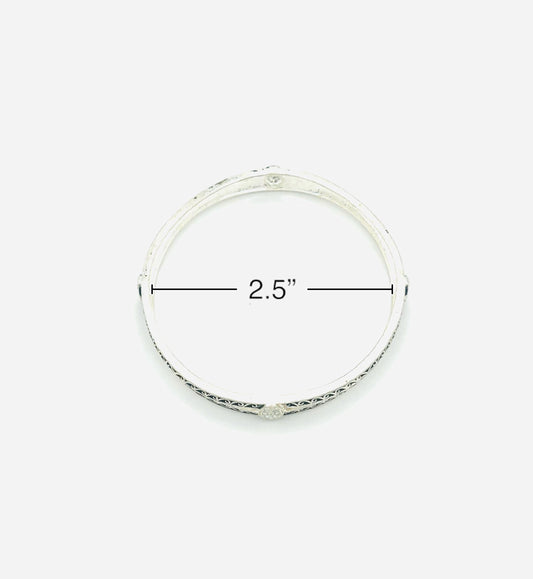 Silver bangle with measurement label on a white background