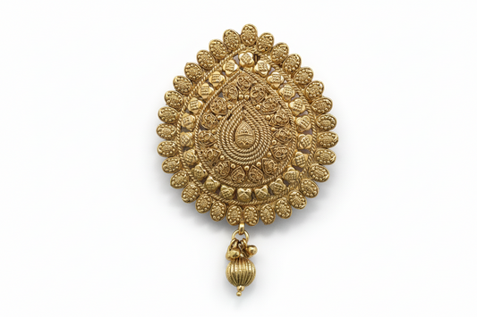 Gold plated hair brooch
with intricate design on a white background
