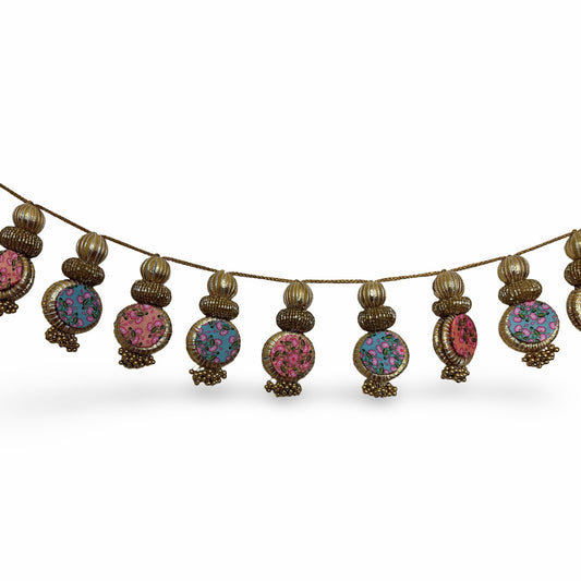 Decorative Toran garland with colorful beads on a white background