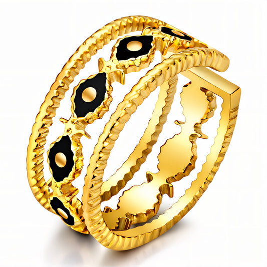 Gold bracelet with black accents on a white background