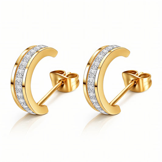 Gold moon-shaped earrings with diamond accents on a white background