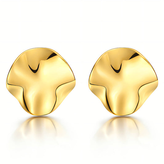 Pair of gold earrings on a white background