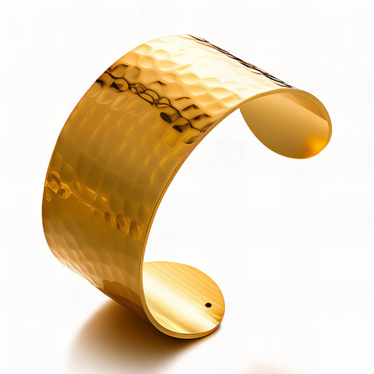 Gold cuff bracelet on a white background