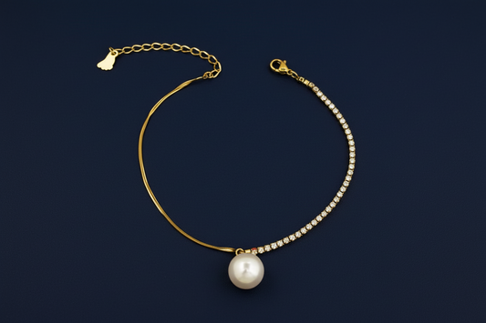 anti tarnish Gold anklet with a pearl pendant on a dark background