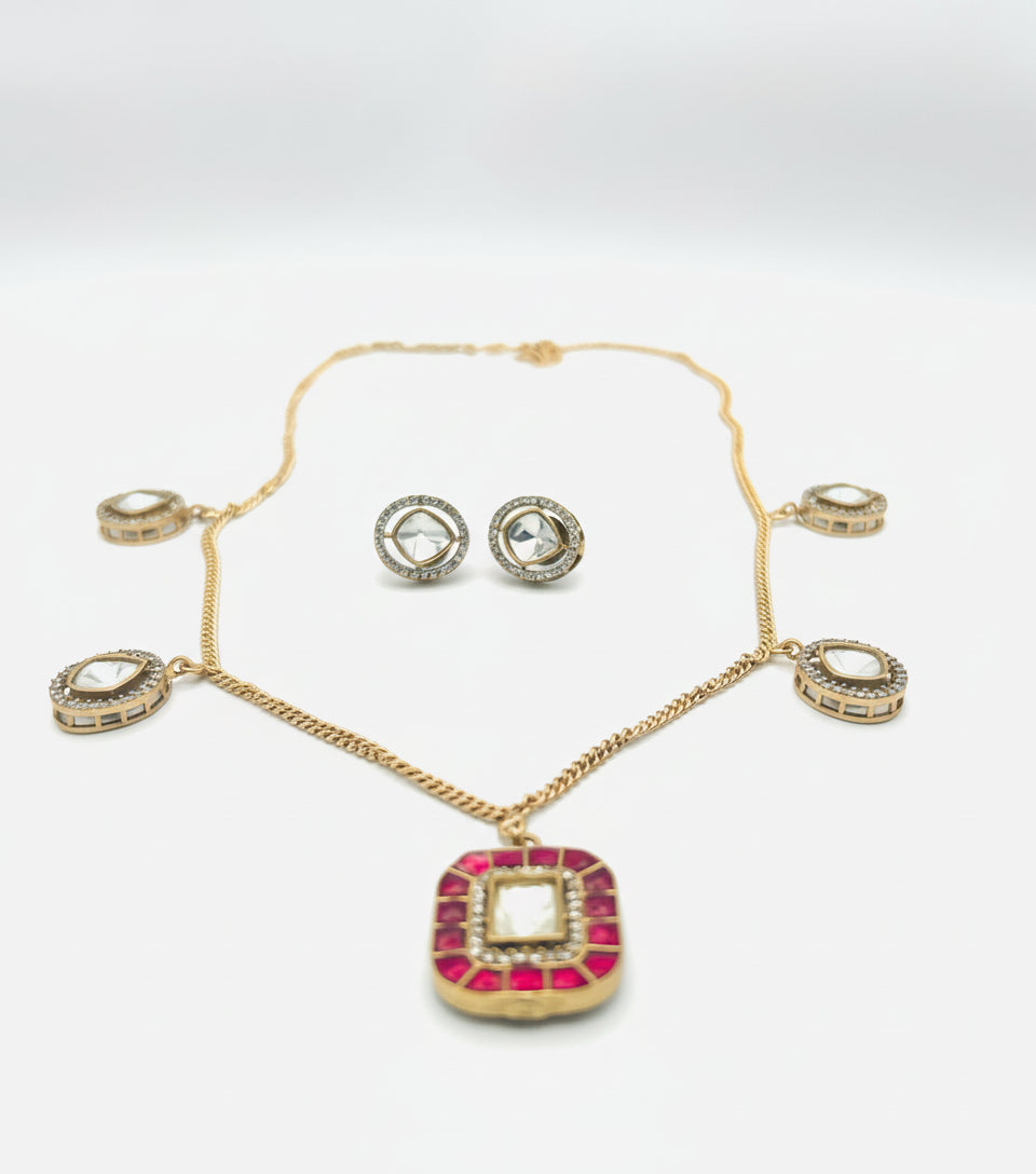 Jewelry set with necklace, bracelet, and earrings on a white background