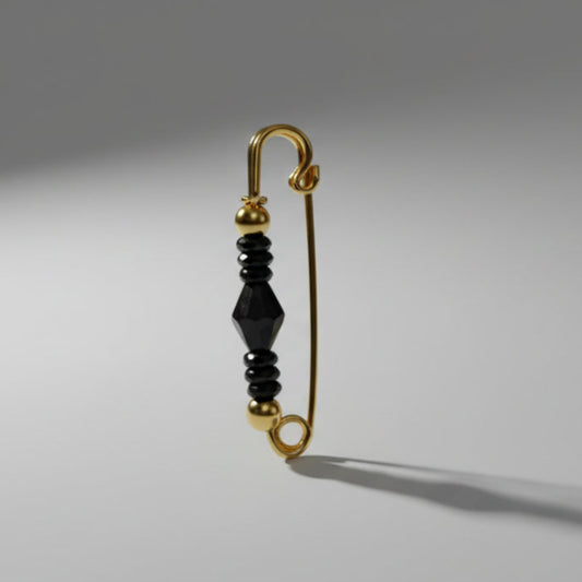 Single safety pin on a light gray background