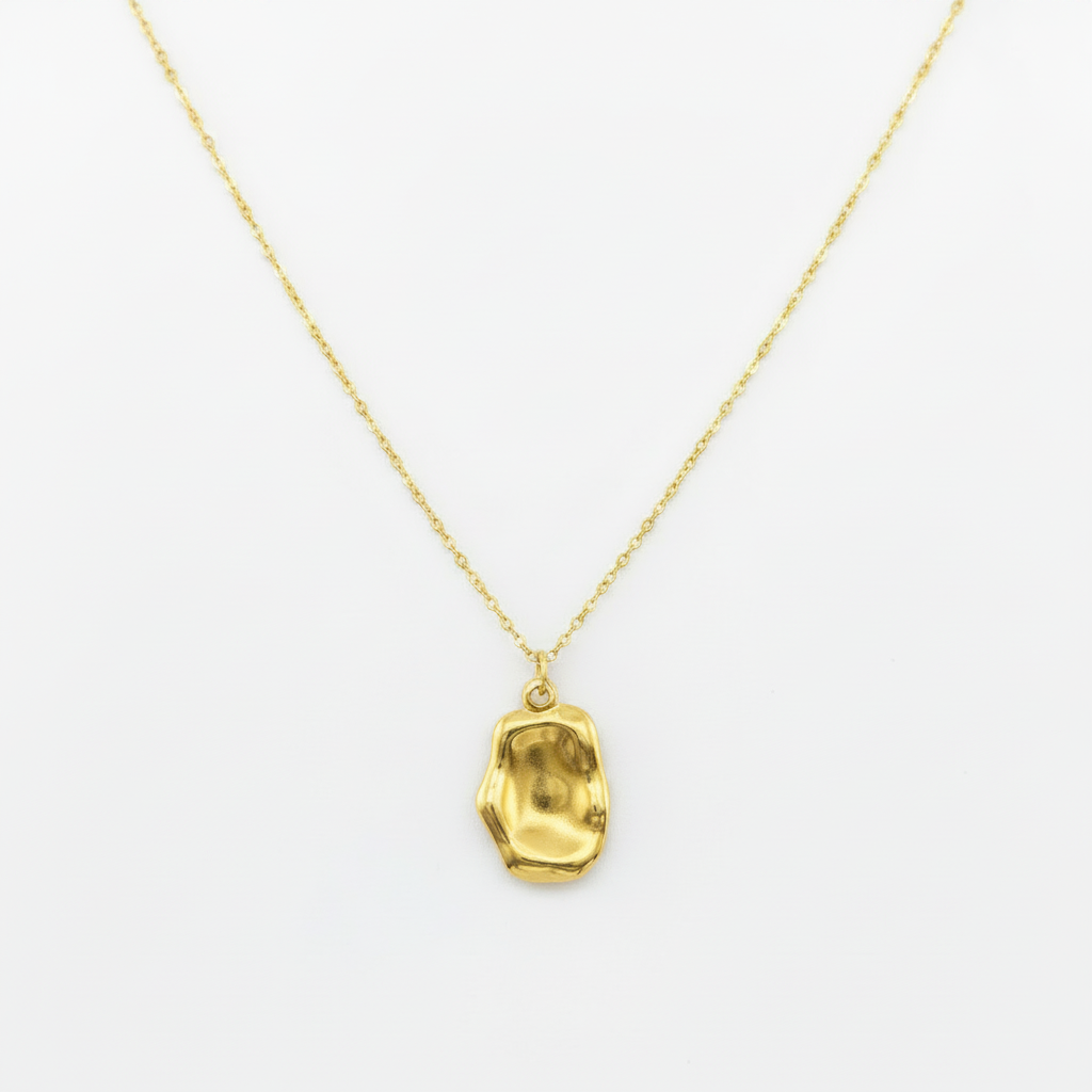 Gold necklace with a pendant on a white background