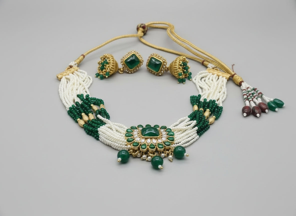 Jewelry set with necklace, earrings, and bracelet on a white background