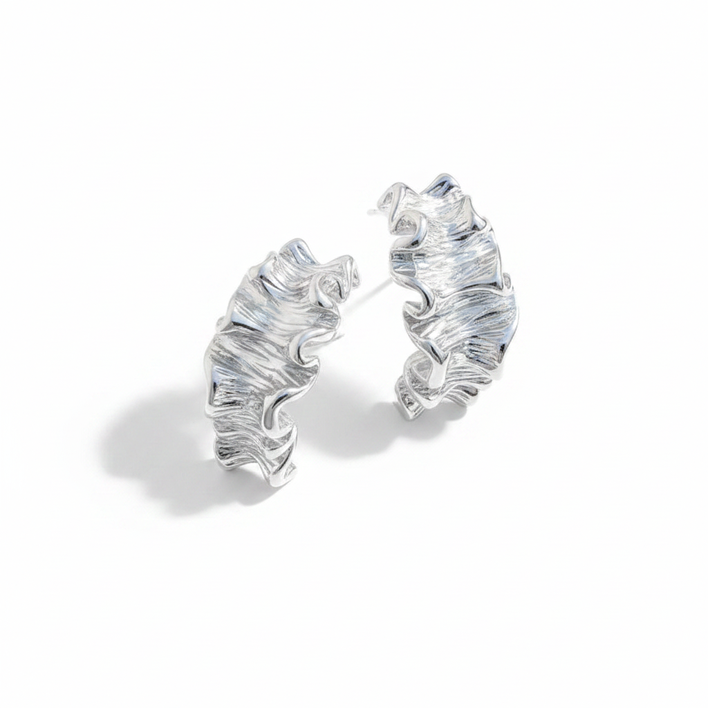 Silver hoop earrings on a white background