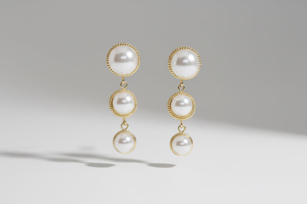 Pair of pearl earrings with Anti Tarnish gold plated  on a #F5F5F5 background