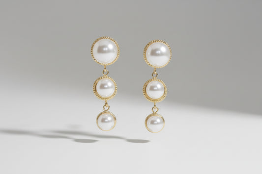 Pair of pearl earrings with Anti Tarnish gold plated  on a #F5F5F5 background