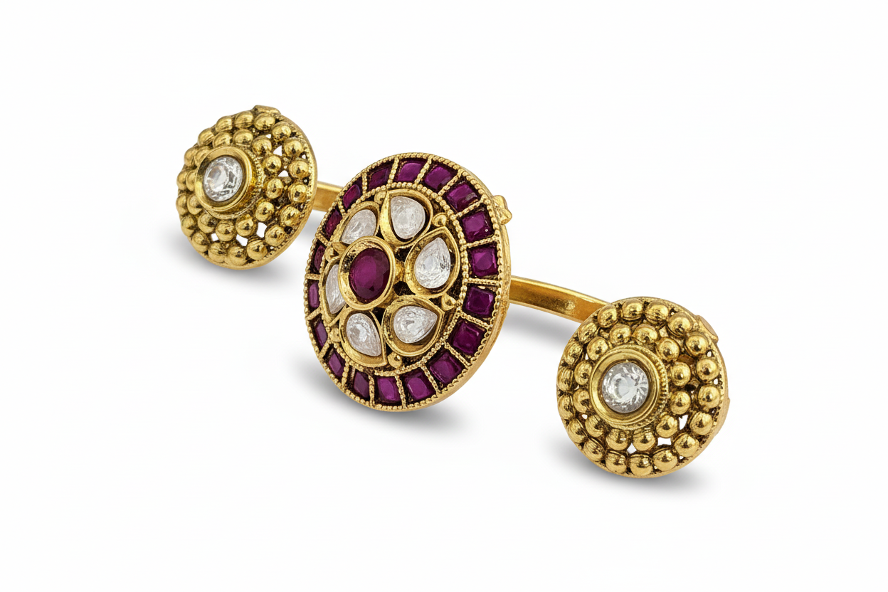 Gold earrings with gemstones on a purple background