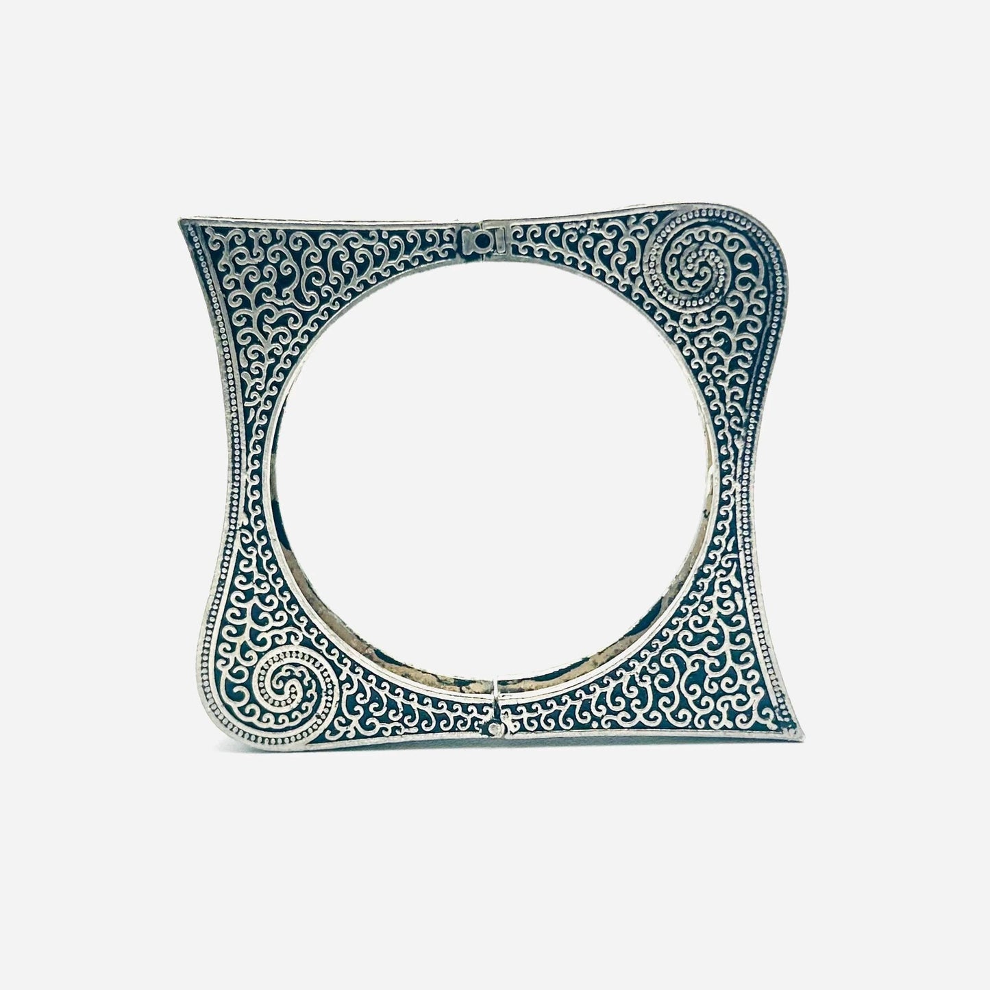 Decorative ceramic tile with intricate blue patterns on a white background