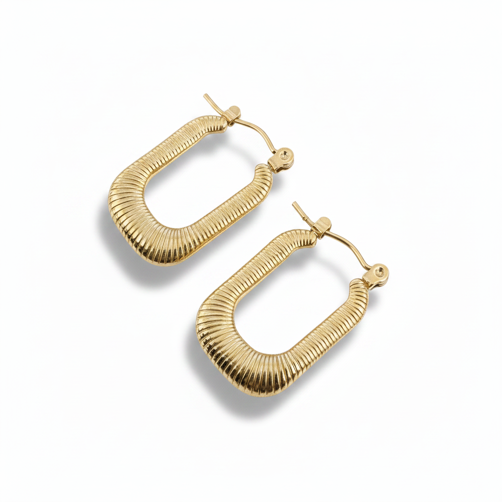 Gold hoop earrings on a white background