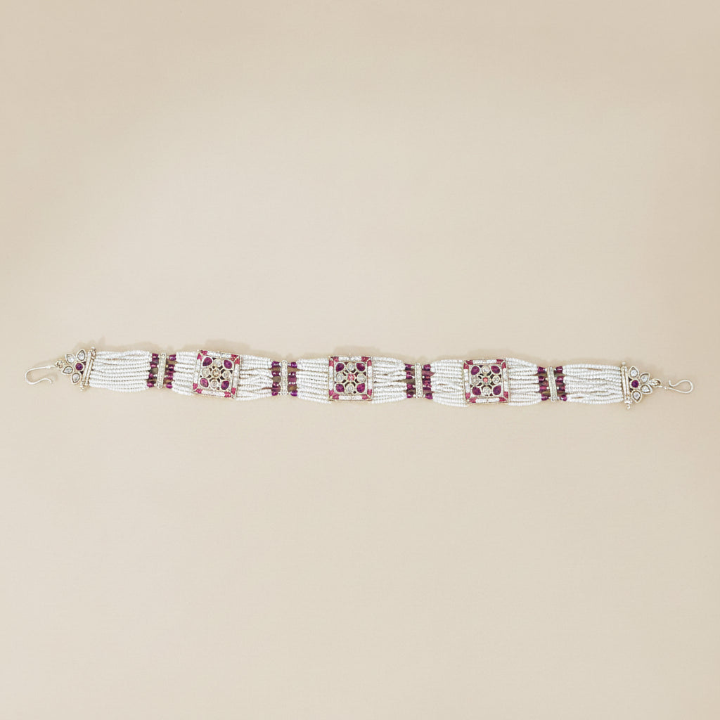 antique ruby red pearl Beaded Headpiece traditional bridal wear on a beige background