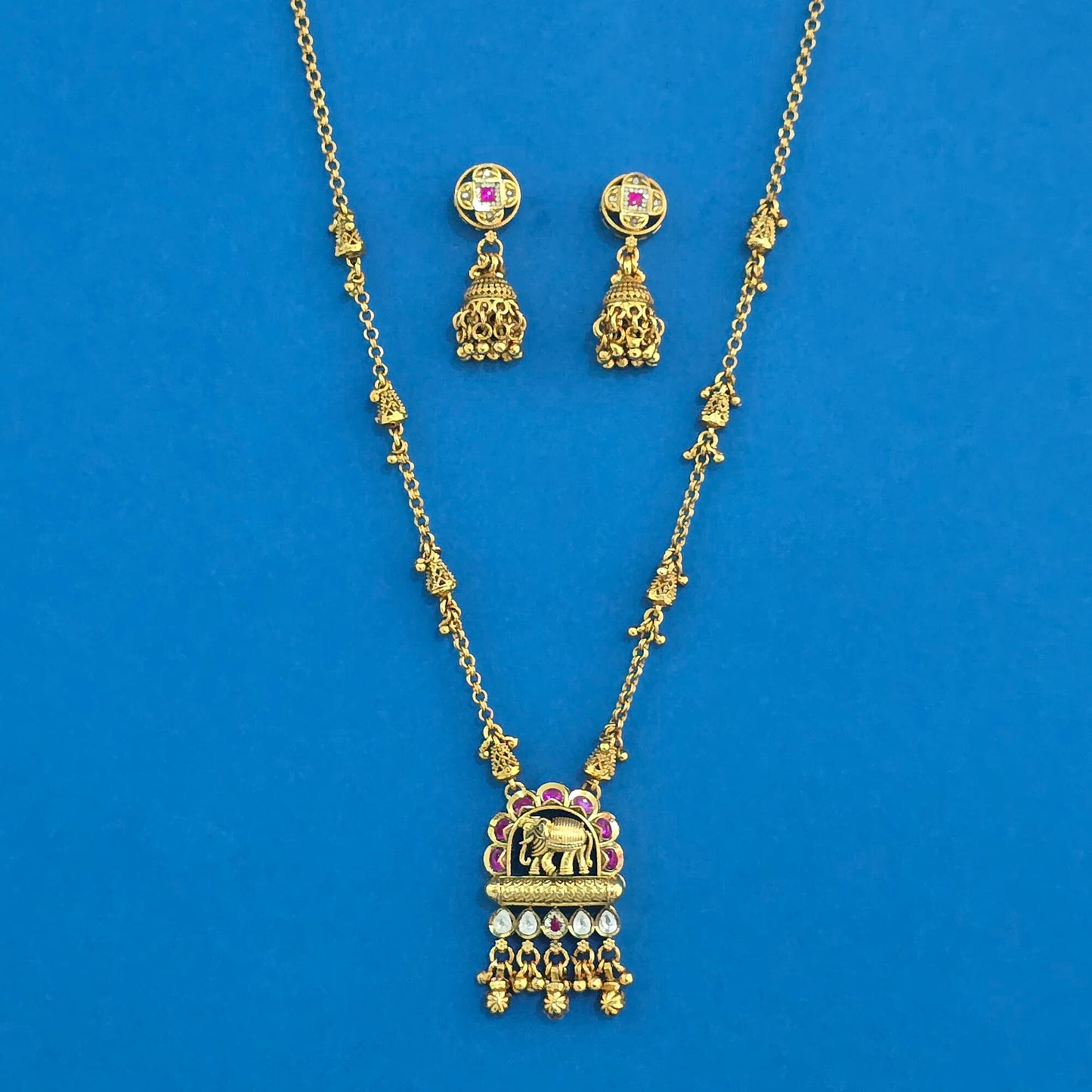 Elephant Motif Antique Pendant Set – Matte Gold Plating with Ruby & Kundan