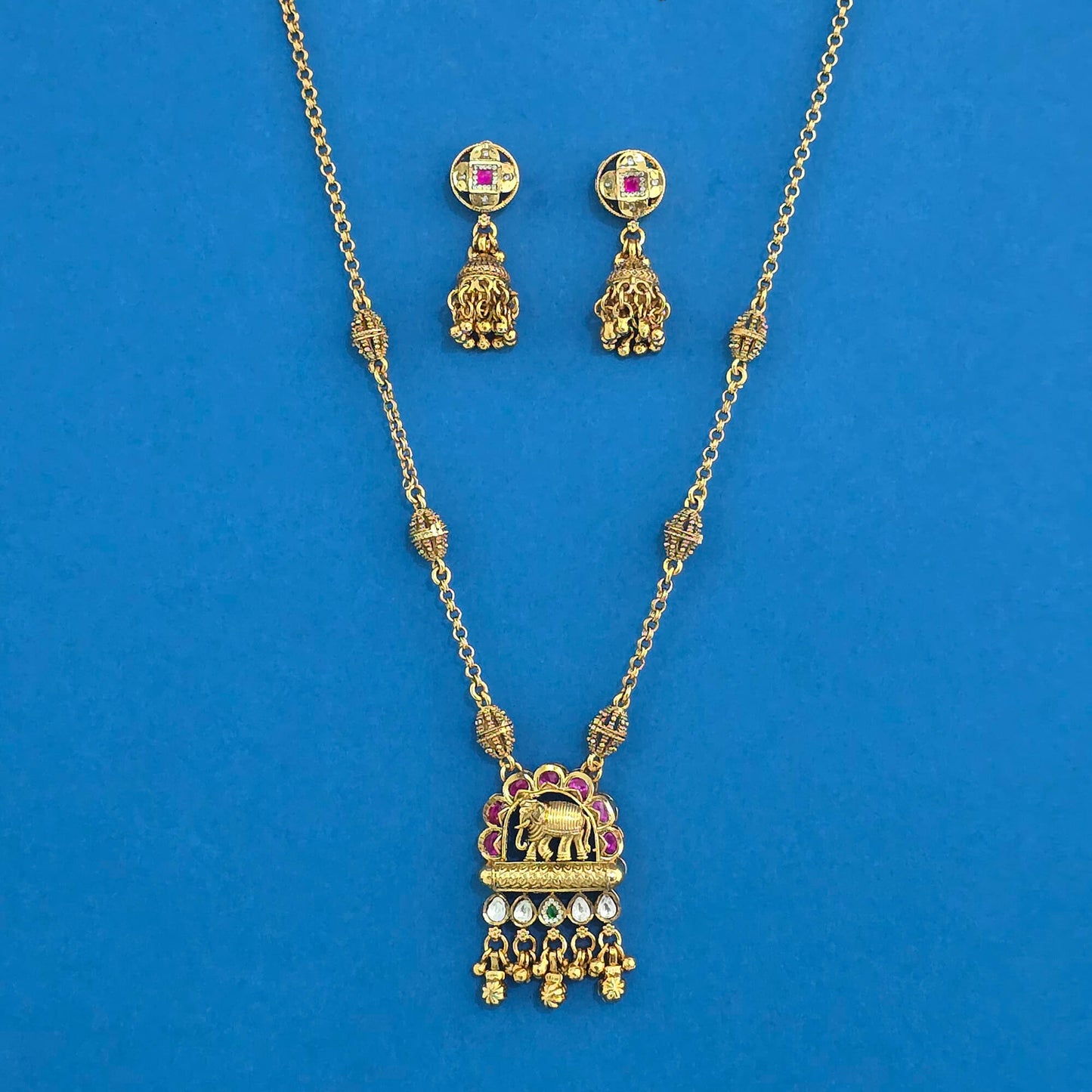 Elephant Motif Antique Pendant Set – Matte Gold Plating with Ruby & Kundan