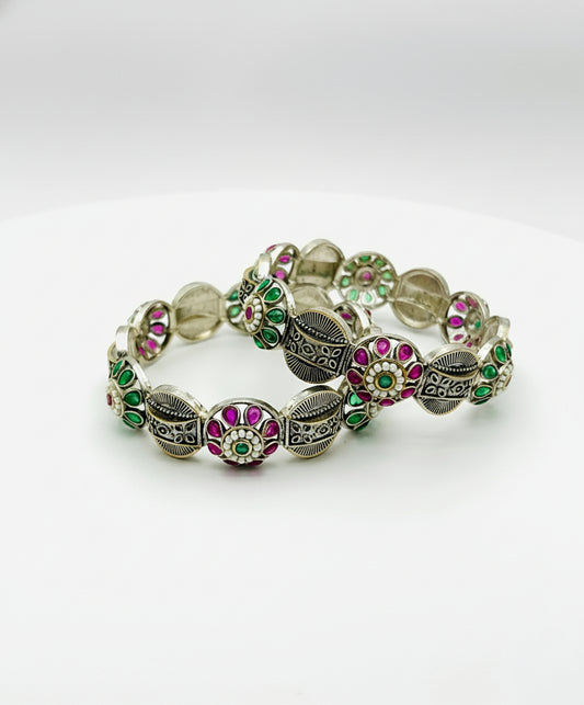 Decorative bracelet with colorful beads on a white background