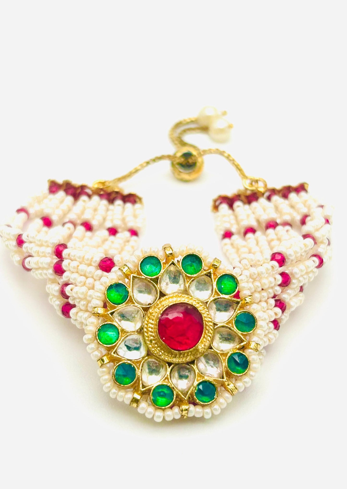 Triangular beaded necklace with green and red stones on a white background