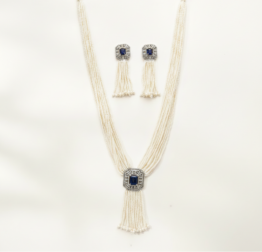 long blue stone pearl beaded Jewelry set with a necklace and earrings on a white background