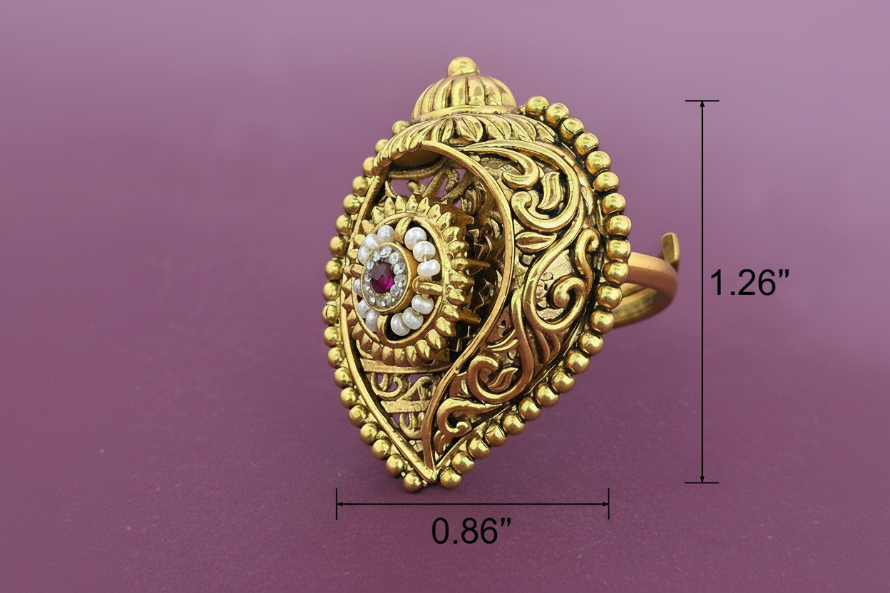 Gold ring with intricate design and gemstones on a purple background