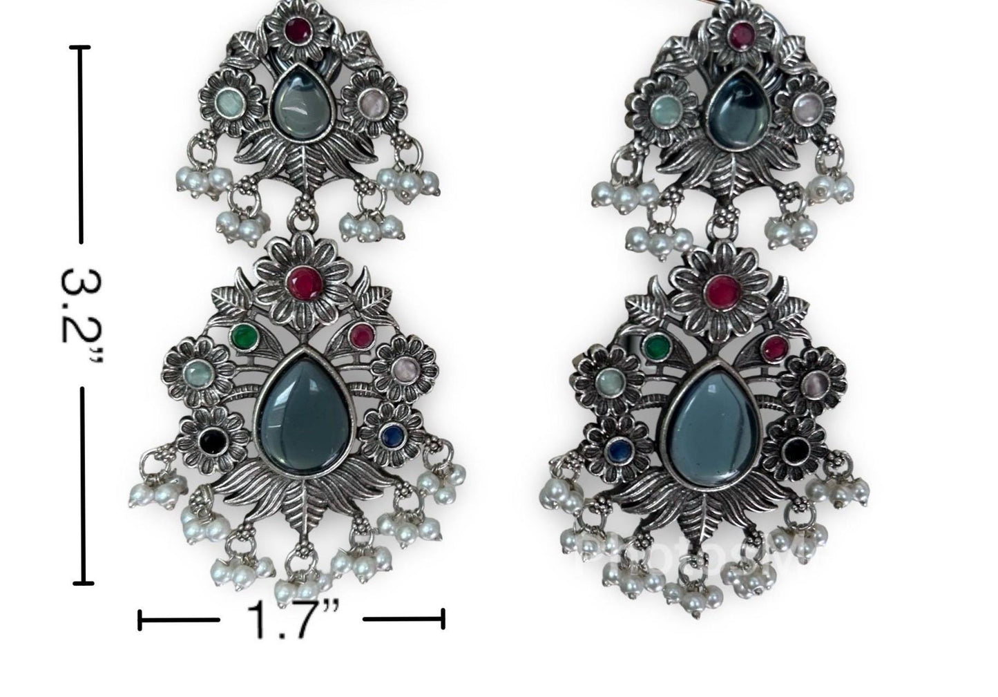 Ornate earrings with gemstones and measurements on a white background