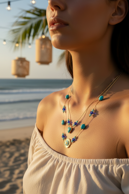 Woman wearing a necklace on a beach with palm trees and lanterns in the background