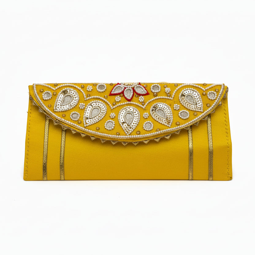 Yellow clutch with intricate gold and silver embroidery on a white background