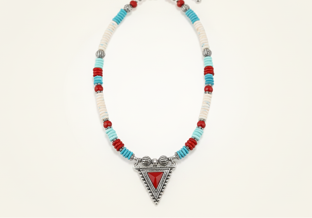 Necklace with colorful beads and a red triangle pendant on a white background