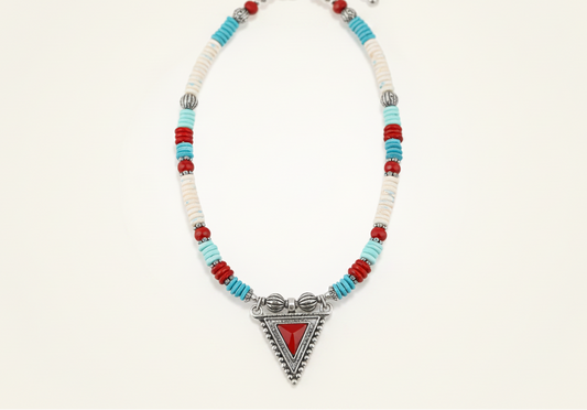 Necklace with colorful beads and a red triangle pendant on a white background