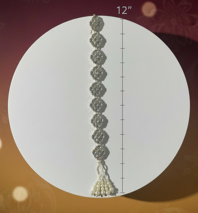 Silver hair chot with pearls on a white circular stand