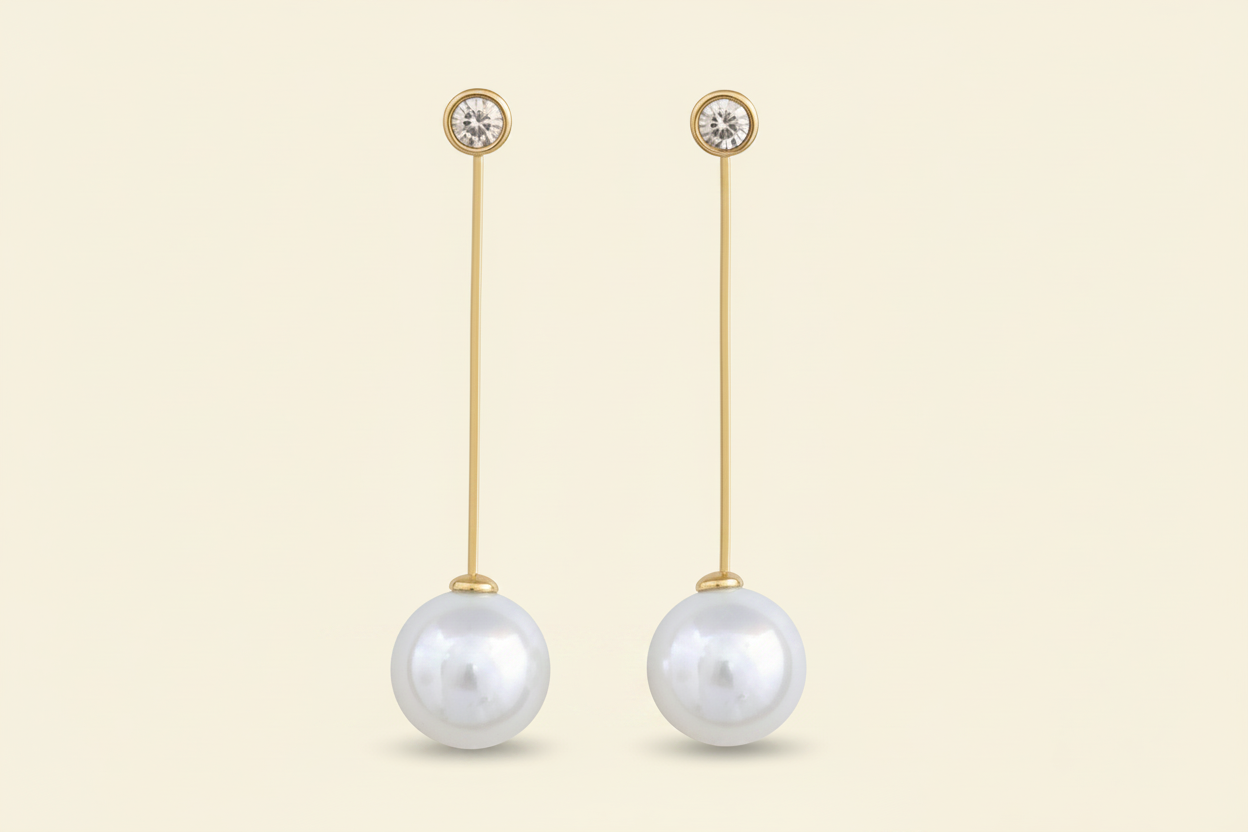Pair of pearl drop earrings with anti tarnish gold plated on a white background