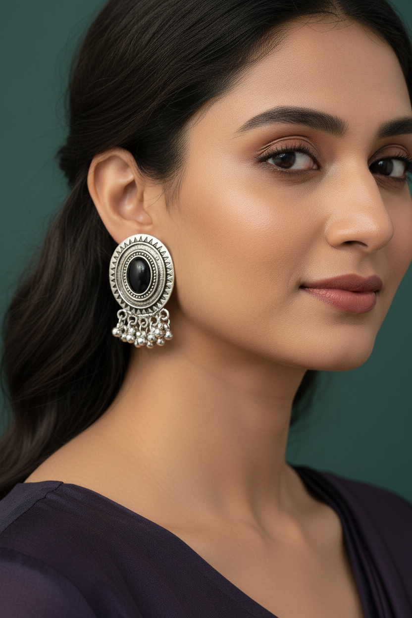 Woman wearing a traditional earring with a dark background