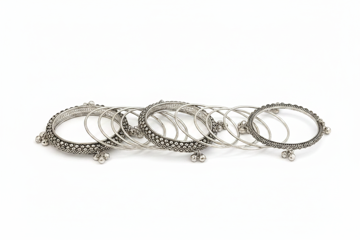 Set of silver stackable chunky bangles on a white background