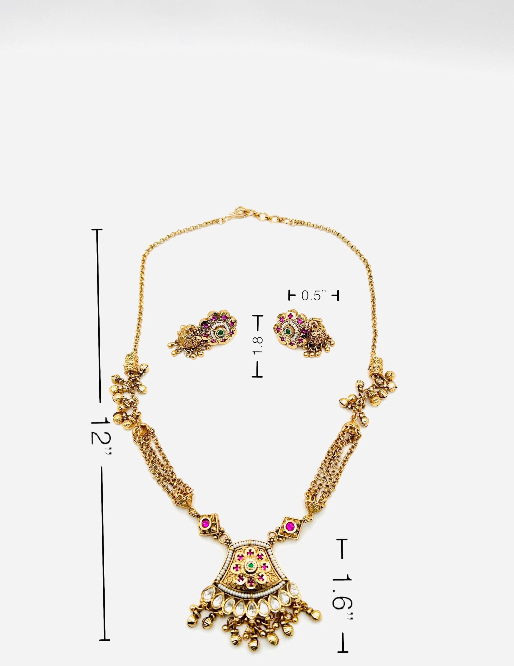 Gold necklace with measurements on a white background