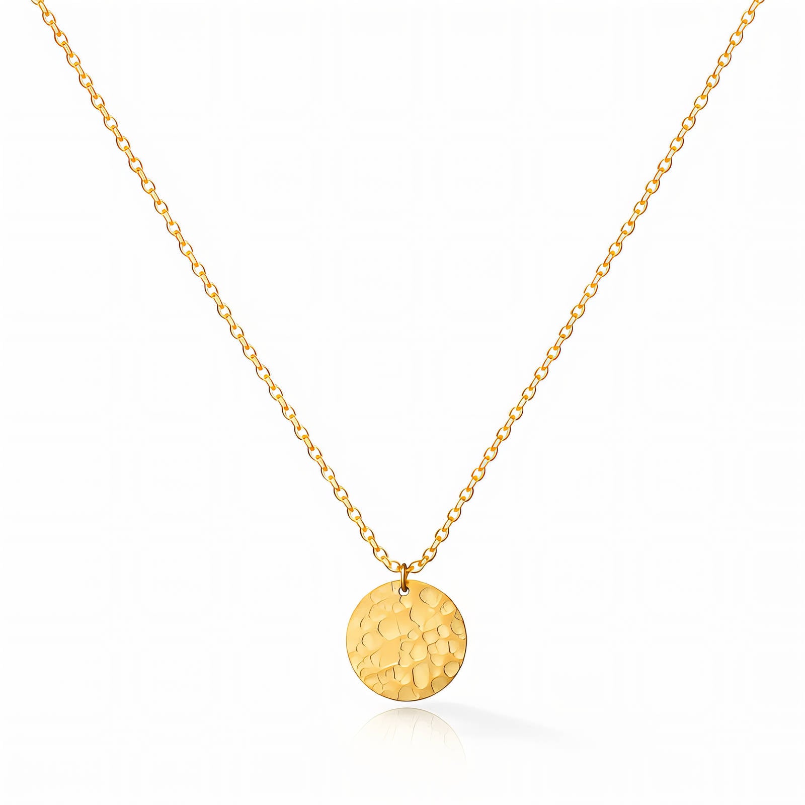 Gold necklace with a round pendant on a white background
