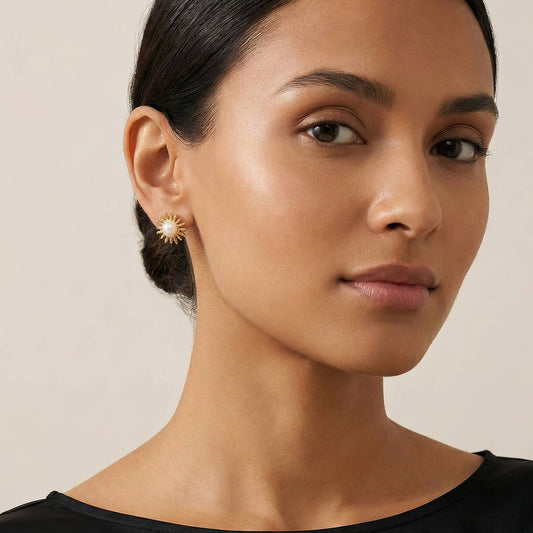 Woman wearing a anti tarnish gold plated  earring against a neutral background