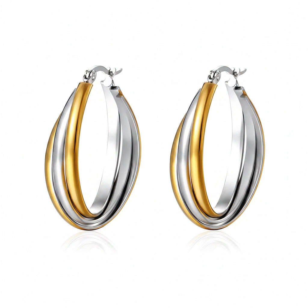 Two-tone gold and silver hoop earrings on a white background