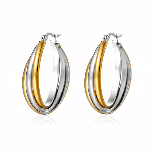 Two-tone gold and silver hoop earrings on a white background