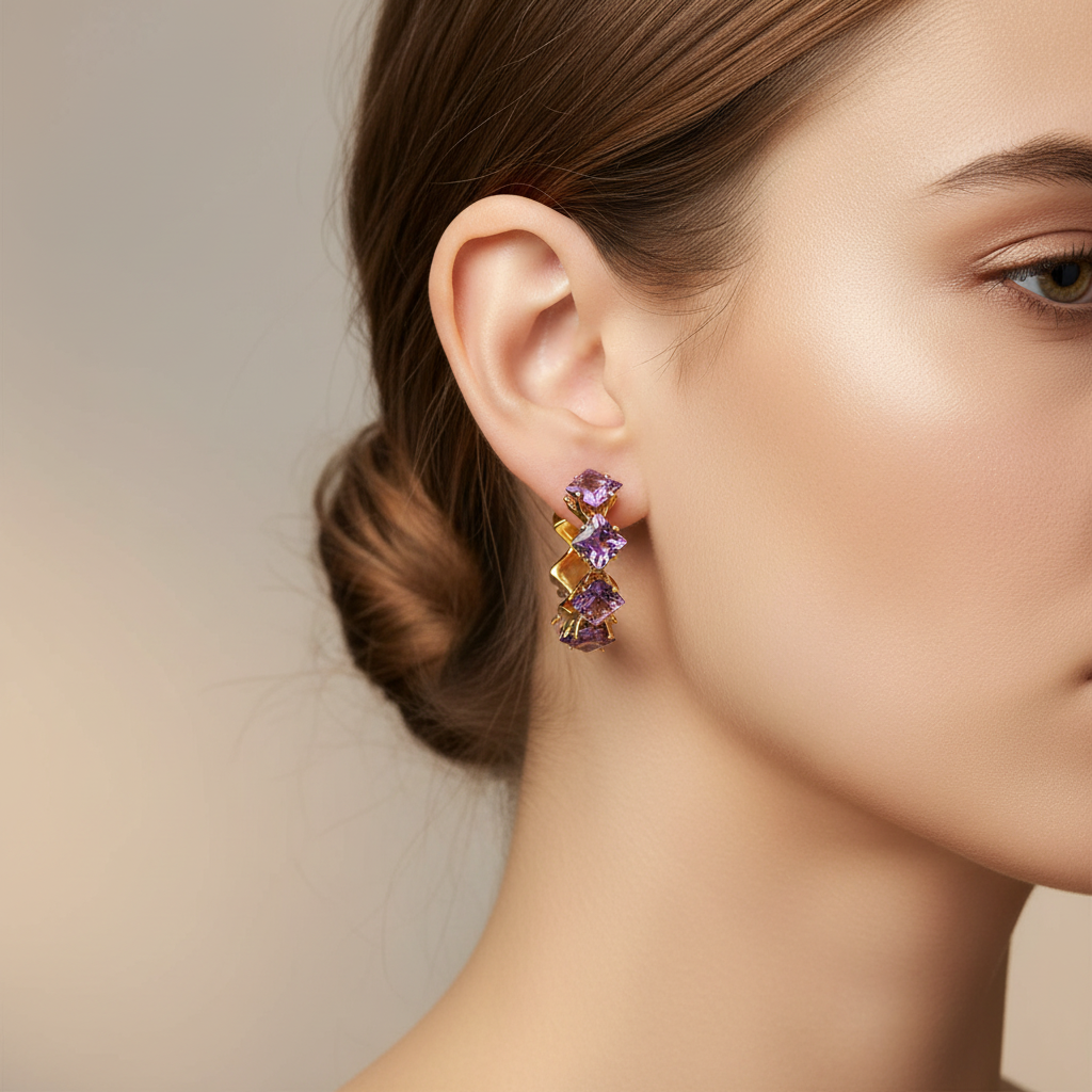 Close-up of a woman wearing a pair of multicolored earrings against a neutral background