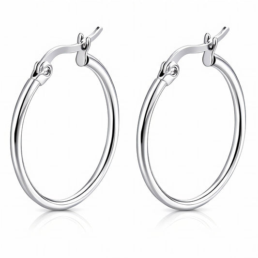Pair of stainless steel silver hoop earrings on a white background