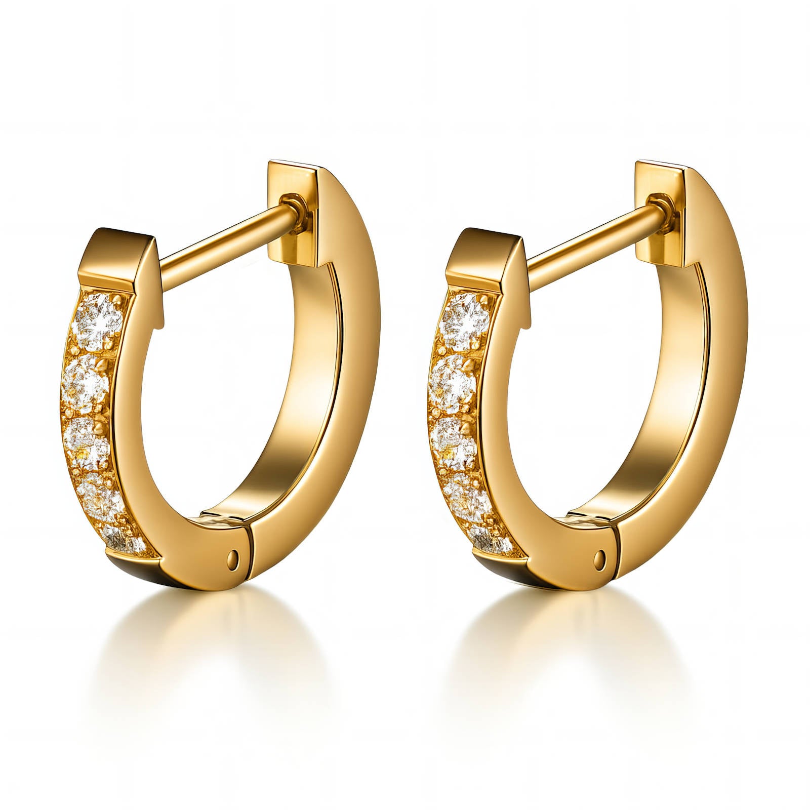 Gold hoop earrings with embedded diamonds on a white background