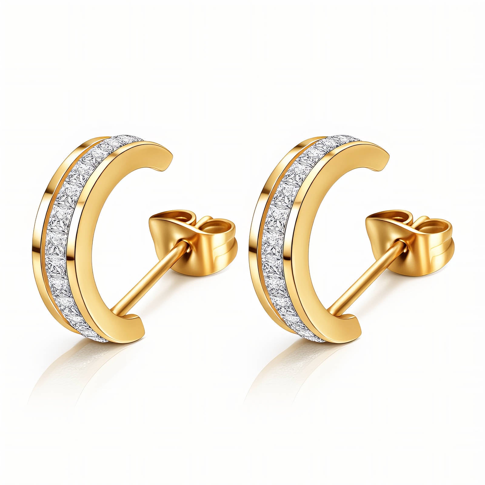 Gold moon-shaped earrings with diamond accents on a white background