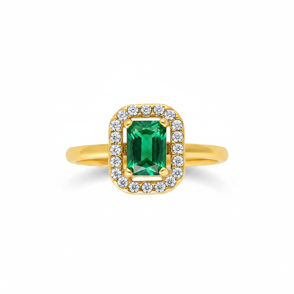 Gold ring with a green gemstone and diamond accents on a white background