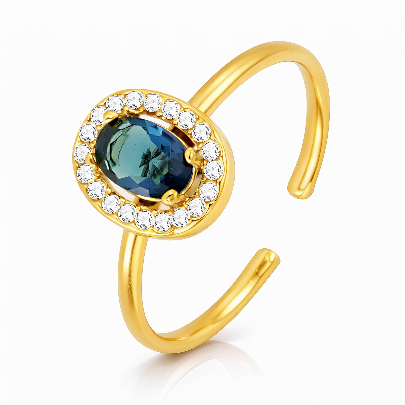 Gold ring with a blue gemstone and clear stones on a white background