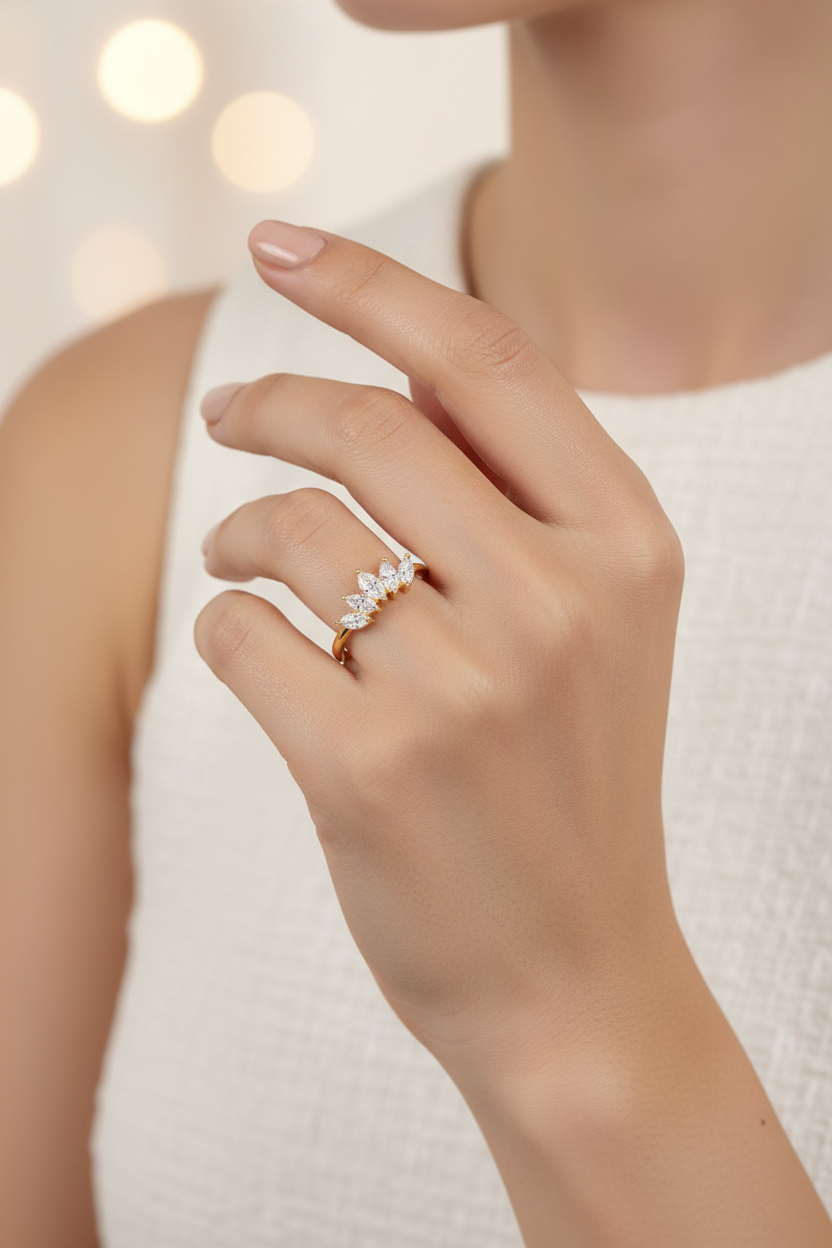 Hand wearing a diamond ring with a blurred background