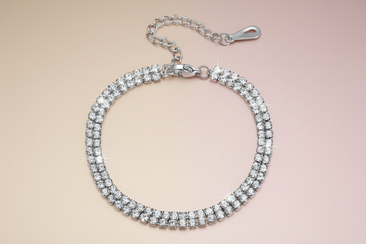 CZ Silver bracelet with clear stones on a beige background