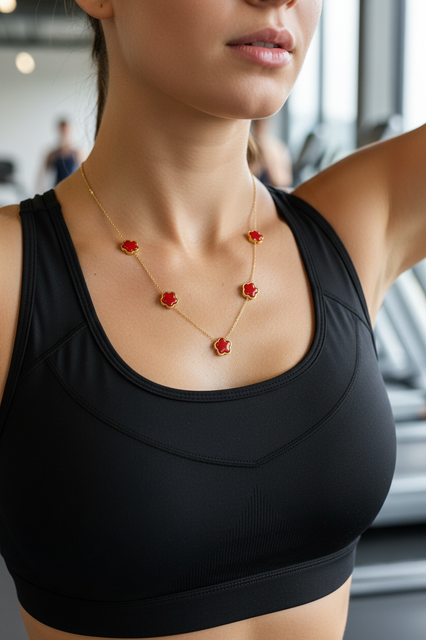Woman wearing 18k gold plated red clove necklace 