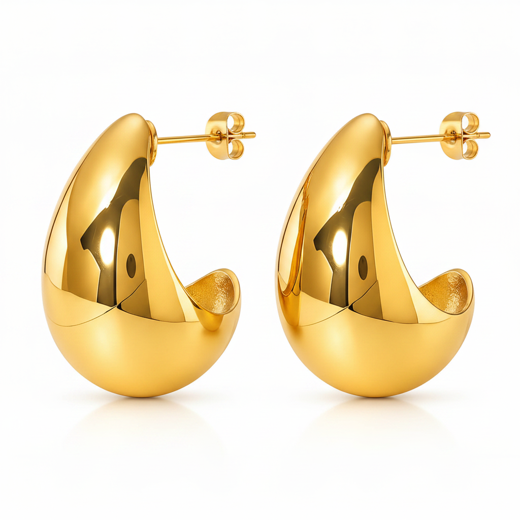 Pair of gold hoop earrings on a white background