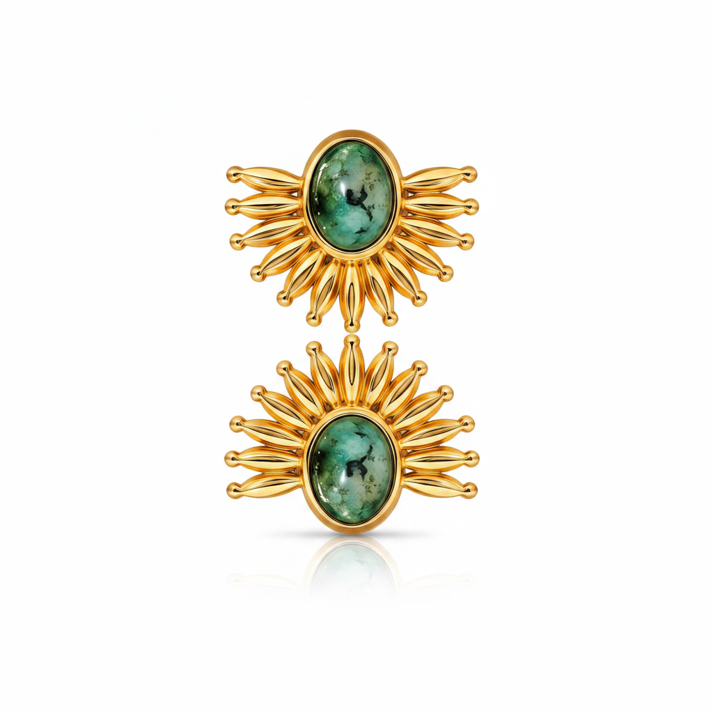 Gold sunburst earrings with green gemstones on a white background